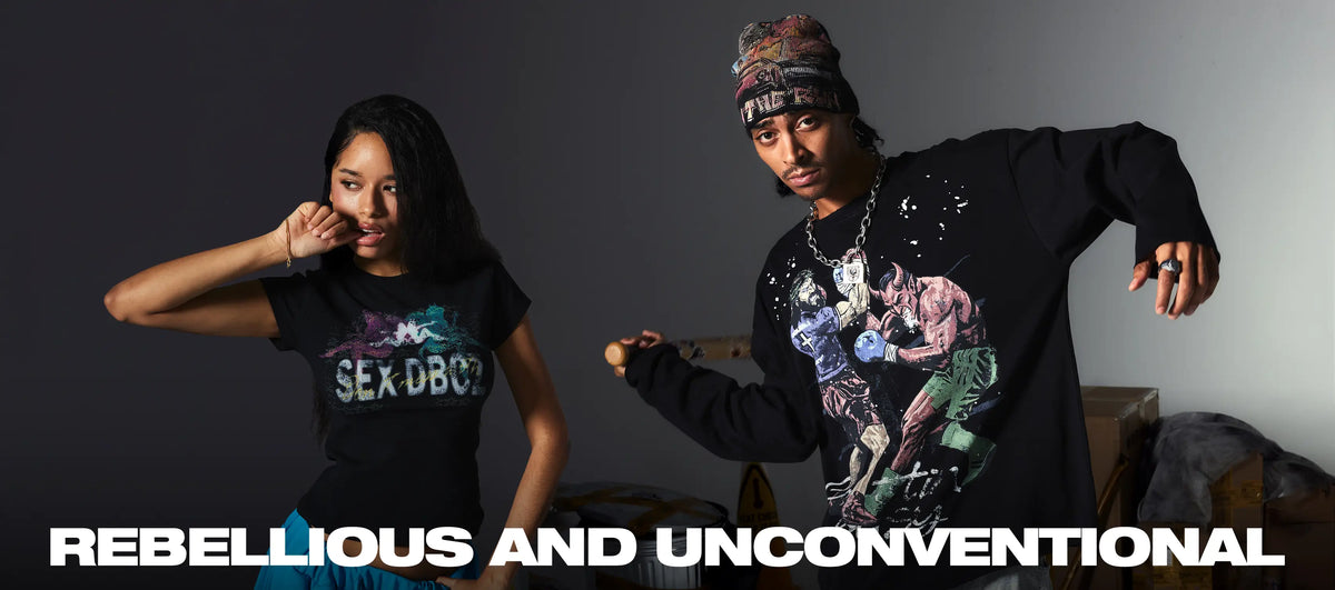 Two models wearing black DoubleCrazy rebellious graphic streetwear featuring distressed and unconventional artwork.
